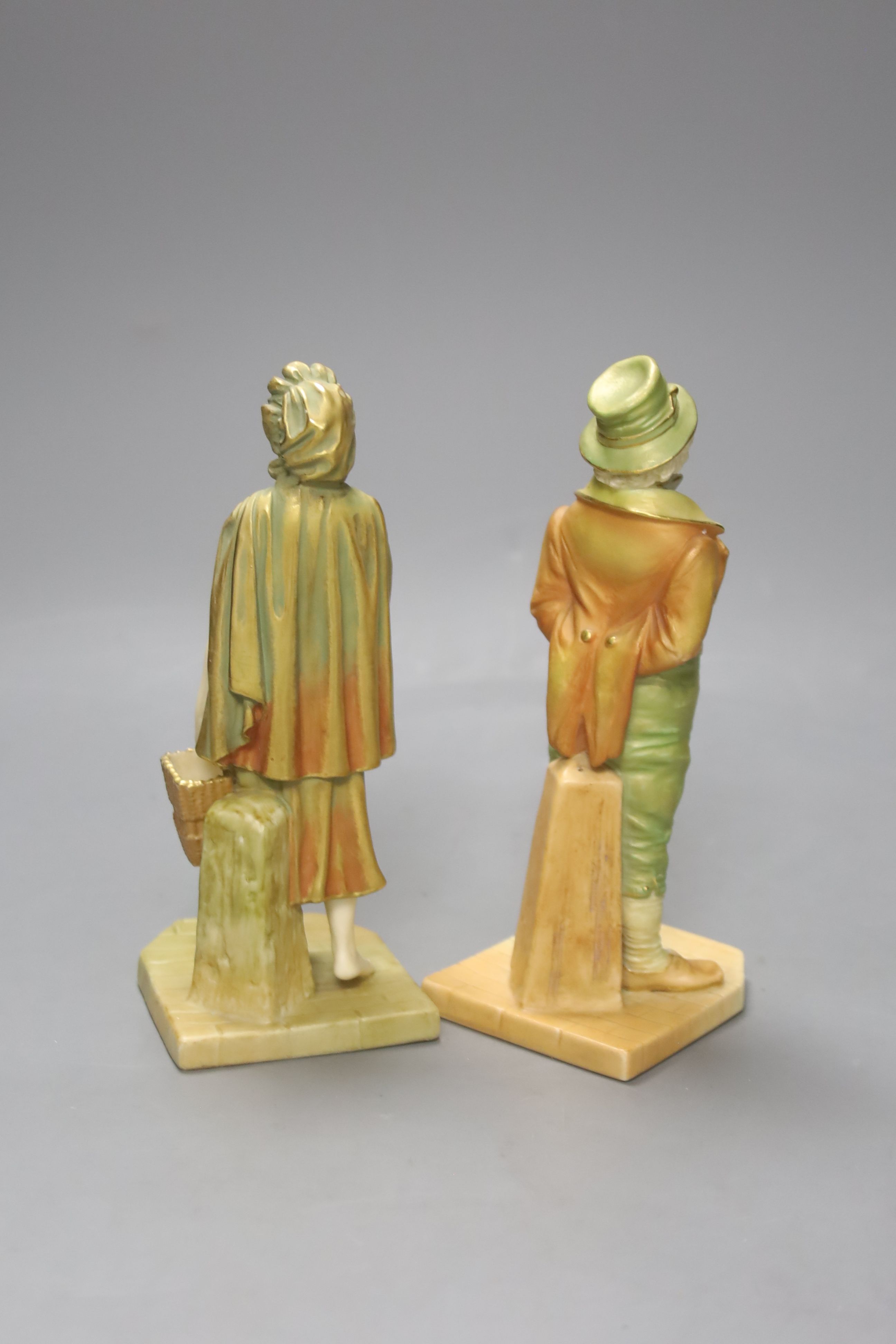 A pair of Royal Worcester blush figures of an Irishman and Irish girl, height 17cm